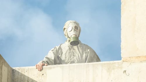 Person in Hazmat Suit in Urban Wasteland