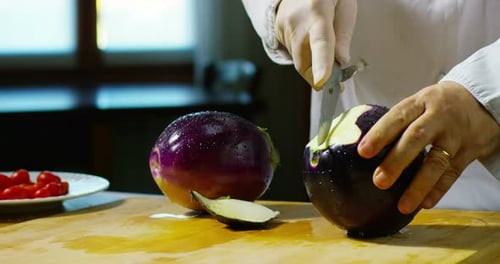 Chef Cutting an Aubergine