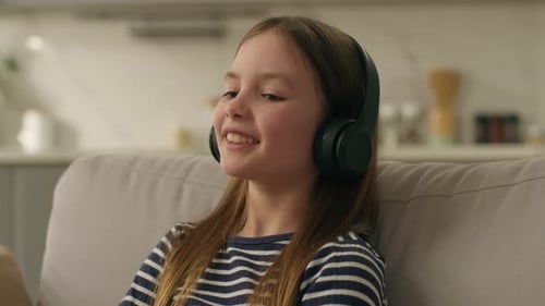 Caucasian Little Girl Headphones Listen Music Smile Entertainment Dancing Movement Plastic Child