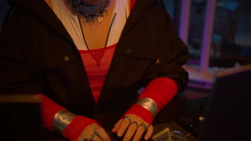 Woman Typing on Keyboard in Cyberpunk Setting