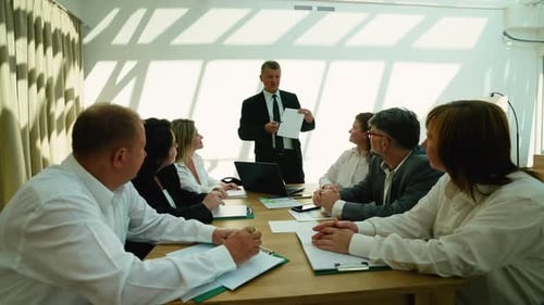 Business team meeting with presentation indoors daytime