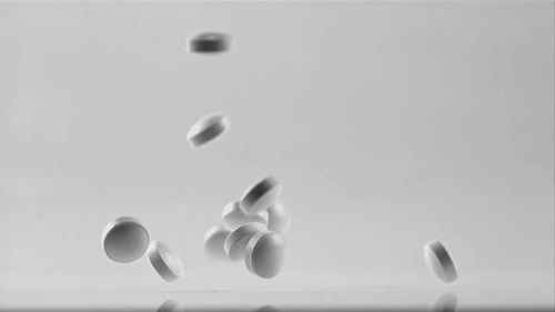 Tablets Fall on the Table Filmed is Slow Motion 1000 Frames Per Second