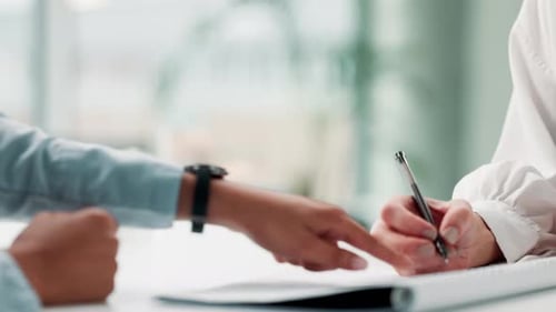 Signature, shaking hands and business people with deal, contract or agreement in office at desk
