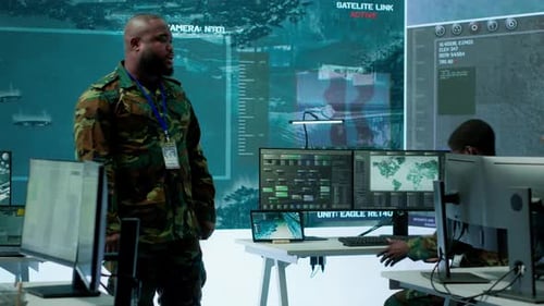 Military Personnel Operate Advanced Systems in a Command Center