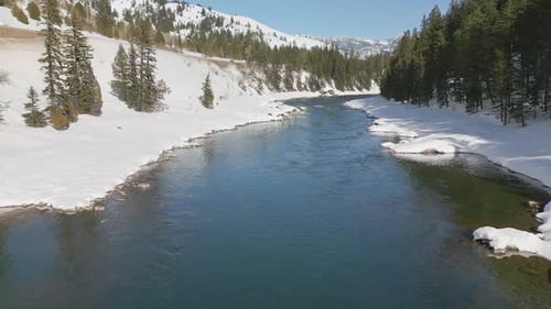 Flying over the Snake River in Jackson Canyon during winter