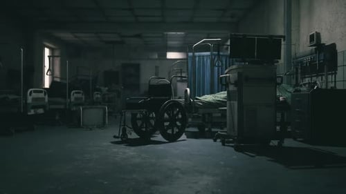 Abandoned Hospital Room Featuring a Wheelchair in Dim Lighting