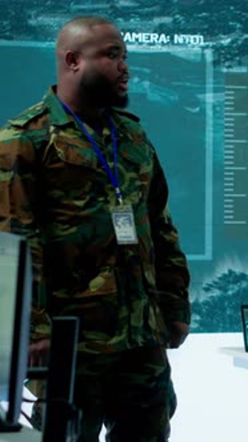 Vertical Video Military Personnel Operate Advanced Systems in a Command Center