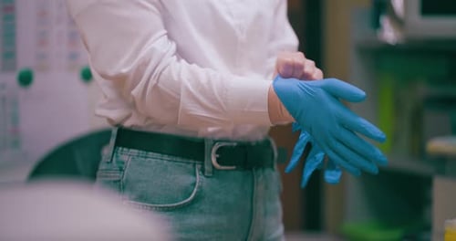 Putting on Protective Surgical Gloves in Office Environment