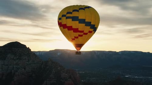 Hot Air Balloon Over Sedona, Arizona During Sunrise - drone shot