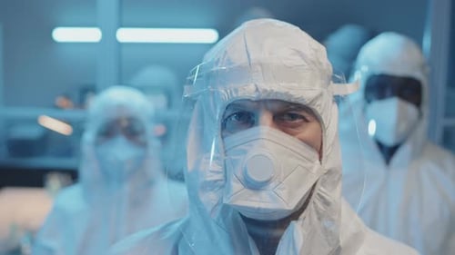 Medical Workers Wearing Protective Gear in Lab