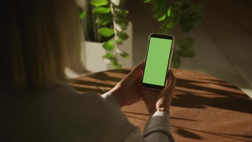 Orbiting Around Woman Watching Green Screen Smartphone