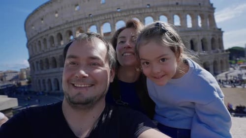 Happy Family Posing at Colosseum in Rome