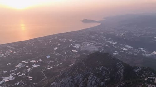 Foggy Urban Landscape From a Bird'seye View at Sunset Cinematic Aerial View