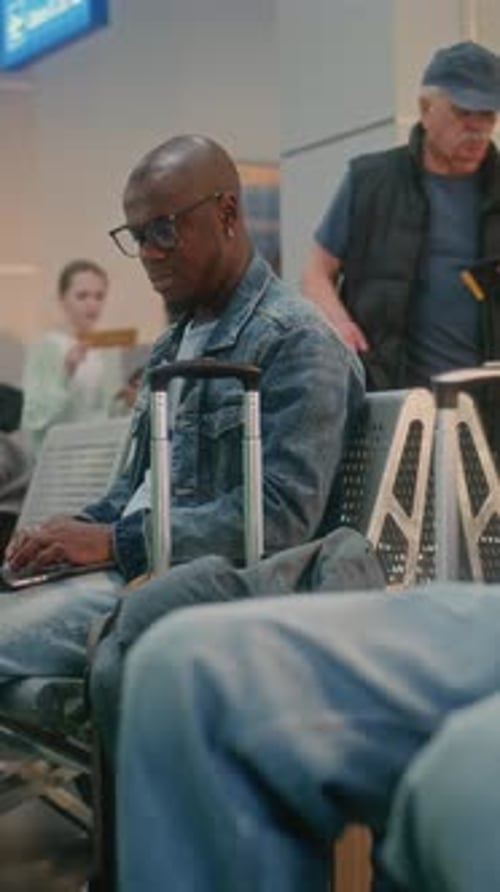 Crowded Airport Terminal Man Working Online on Laptop Waiting for Airplane Flight