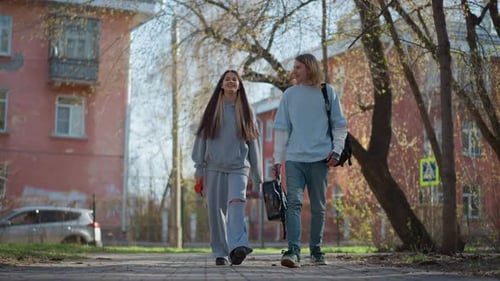 Two Companions of European Descent Enjoying Casual Walk Together Duo of Friends of White Ethnicity