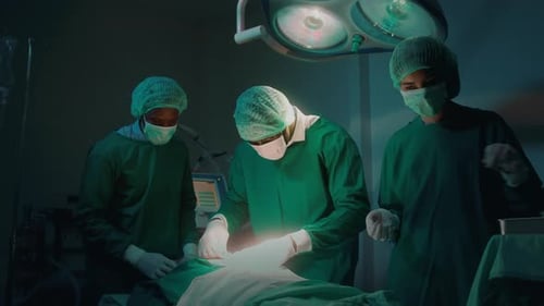 Surgeons Performing Operation in a Hospital Operating Room