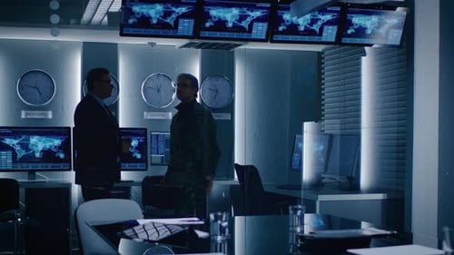 Men Talking in Modern Office with World Clocks