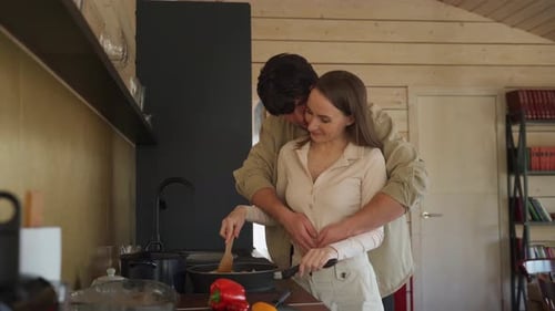 Affectionate Couple Cooking Together at Home