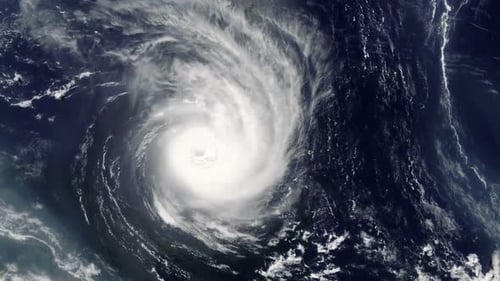 A hurricane moving over the ocean. View from space.