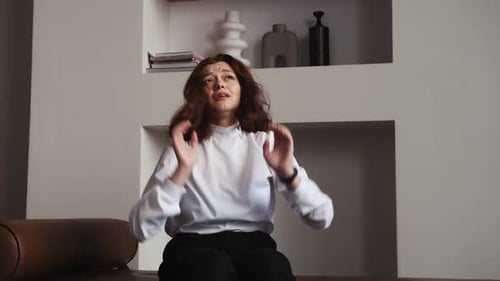 Young Woman Crying Indoors At Home