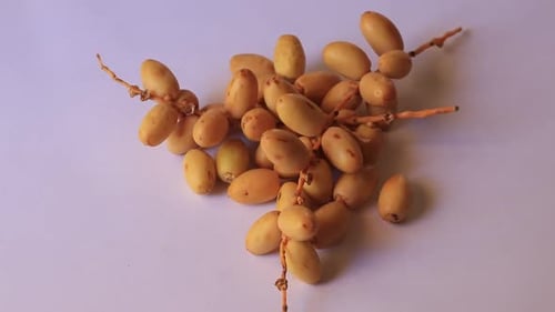 The date-palm fresh they are placed on the table with oil, health food concept., Date Palm. Raw Date