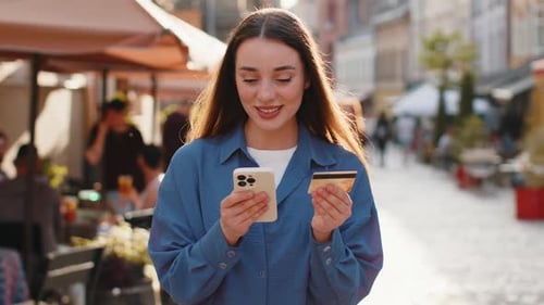 Young Woman Using Credit Bank Card Smartphone While Transferring Money Purchases Online Shopping