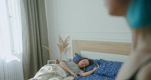 Crop Woman Admiring Sleeping Girlfriend