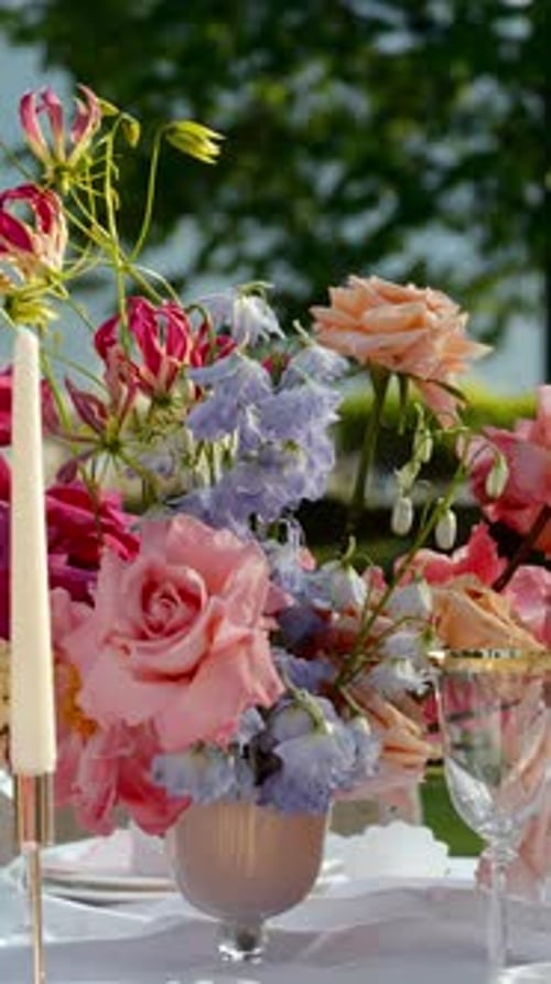 Elegant Floral Centerpiece at Outdoor Wedding Reception