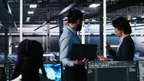 Data Center Manager Supervising Work Done By Programmers on Neural Network