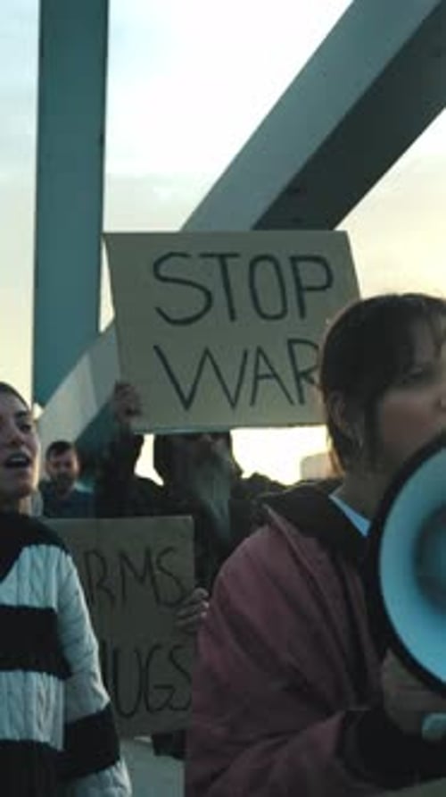 Group of People Protesting with Signs and Megaphone