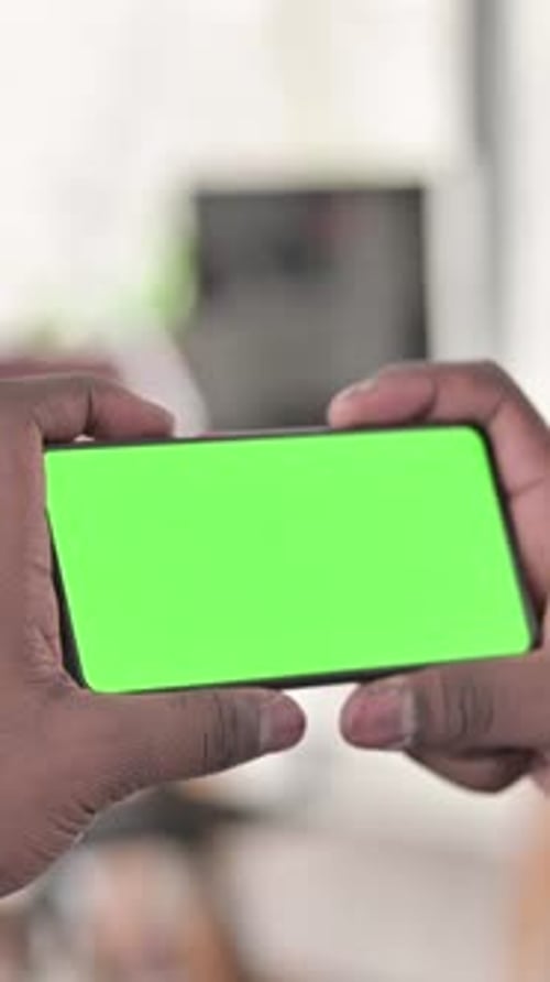 Chroma Key, African Man Holding Smartphone Horizontal, vertical video