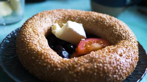 Closeup Of Simit With Butter And Tomato, A Turkish Breakfast Bread Bagel