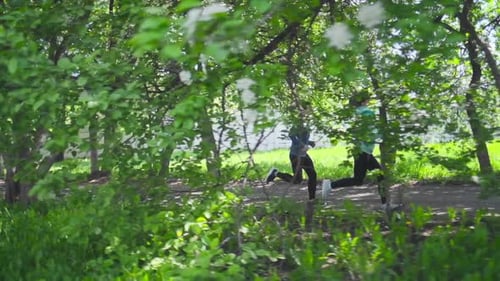 Sportive young people running. Couple run in the park during the day