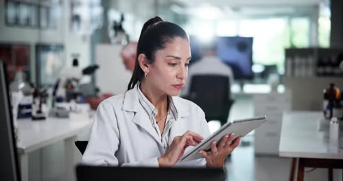 Female Scientist Using Tablet in Modern Laboratory