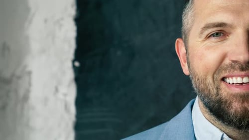 Smiling Man in Blue Blazer Half Portrait