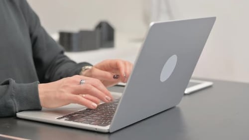 Close up of Female Hands Typing on Laptop
