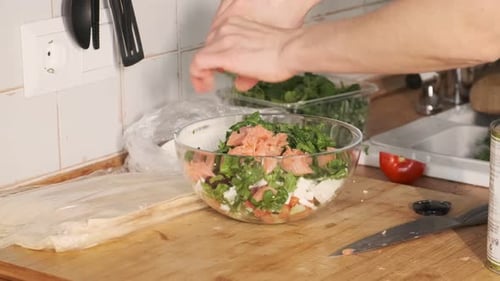 Salad - a fragrant dish of tomatoes, cucumbers, red fish and parsley with salt and butter