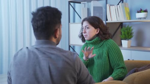 Woman Arguing with Man During Heated Discussion