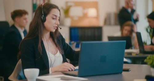 Businesswoman Showing Data on Video Call in Office