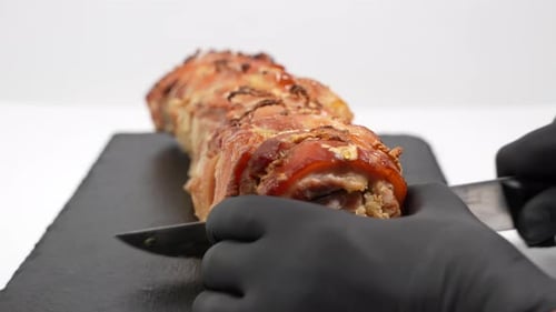 Cuts baked pork, wrapped in a roll.