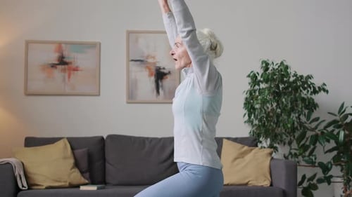 Elegant Senior Woman Doing Yoga at Home