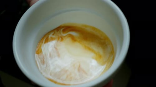 Barista Make Coffee Latte Art with Coffee Espresso Machine in Coffee Shop