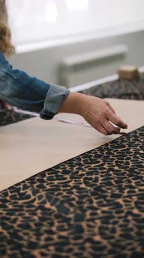 Measuring Leopard Print Fabric with Measuring Tape