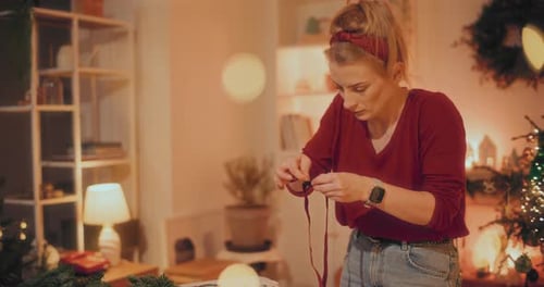 Woman Preparing Christmas Wreath Preparations For Christmas Holidays