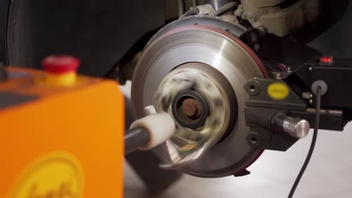 Automotive Technician Resurfaces Brake Disc with Precision Lathe Garage Equip Repairs Rotor Ensures