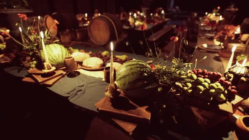 A Delightful Banquet Featuring Various Foods and Drinks at an Evening Gathering