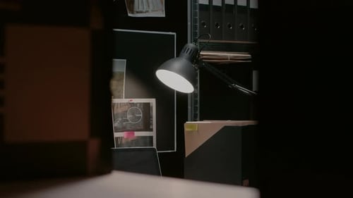 Dimly Lit Desk in an Office at Night