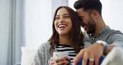 Affectionate Couple Relaxing and Smiling at Home