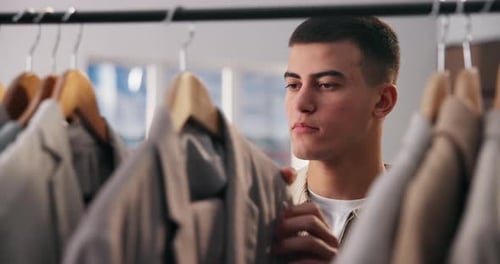 Man, clothes and thinking for small business, sale and creative fashion boutique with choice