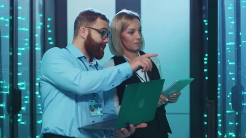 IT Professionals Working in Data Center Server Room